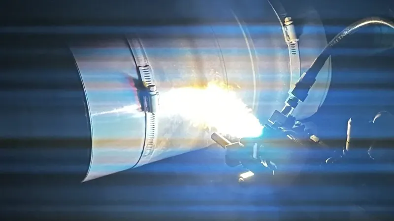 Plasma spray coating a large cylindrical part