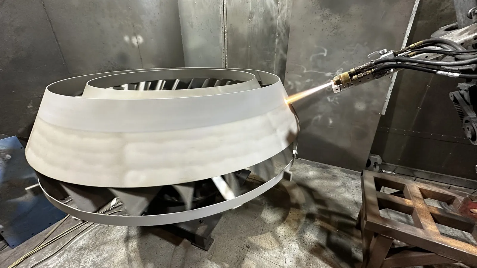 Applying a chrome carbide coating to a conical part