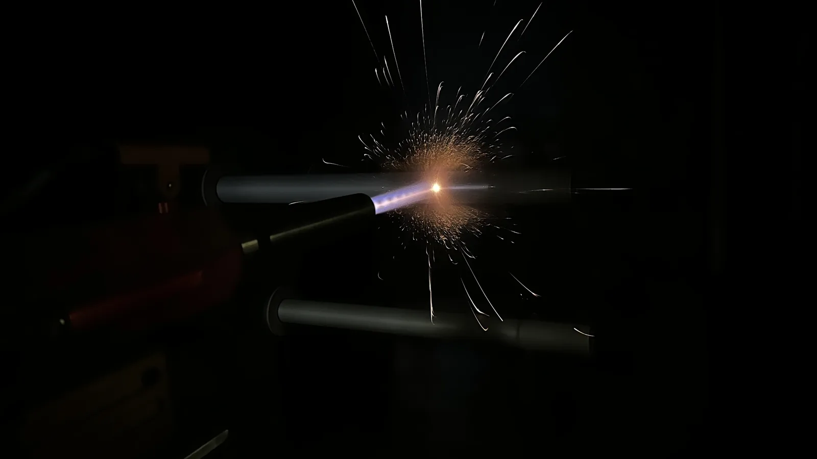 HVAF gun coating a pair of tubes on the spray lathe